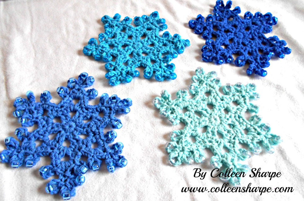 crocheted and beaded blue snowflakes